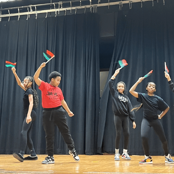 Student play Students performing and waving flags